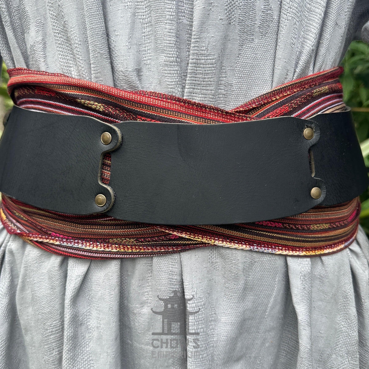 LARP sash and belt set in red autumn stripe, buffalo leather close-up.