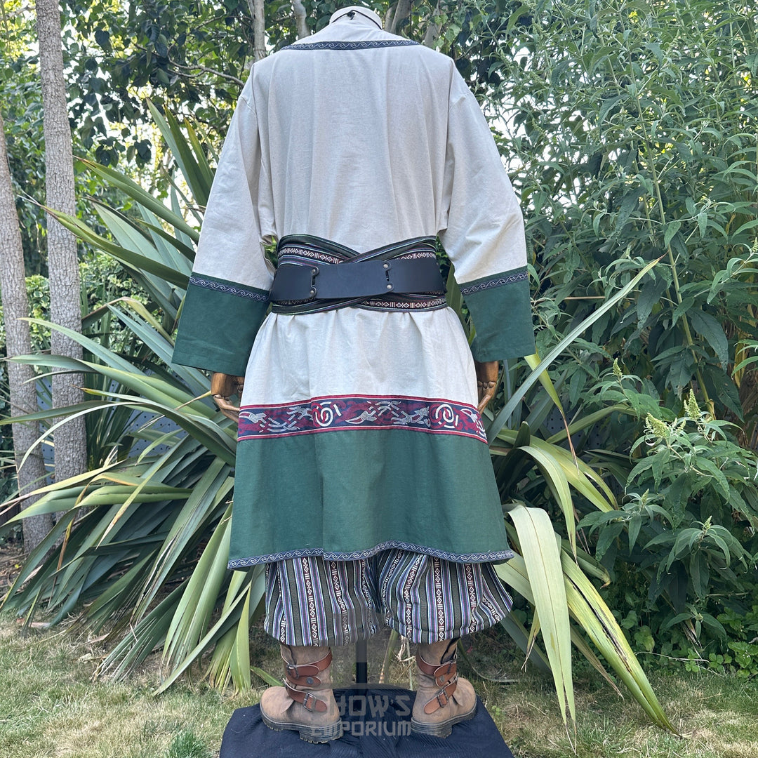 Viking Healer LARP outfit back view: robe, green trim, striped pants, sash.