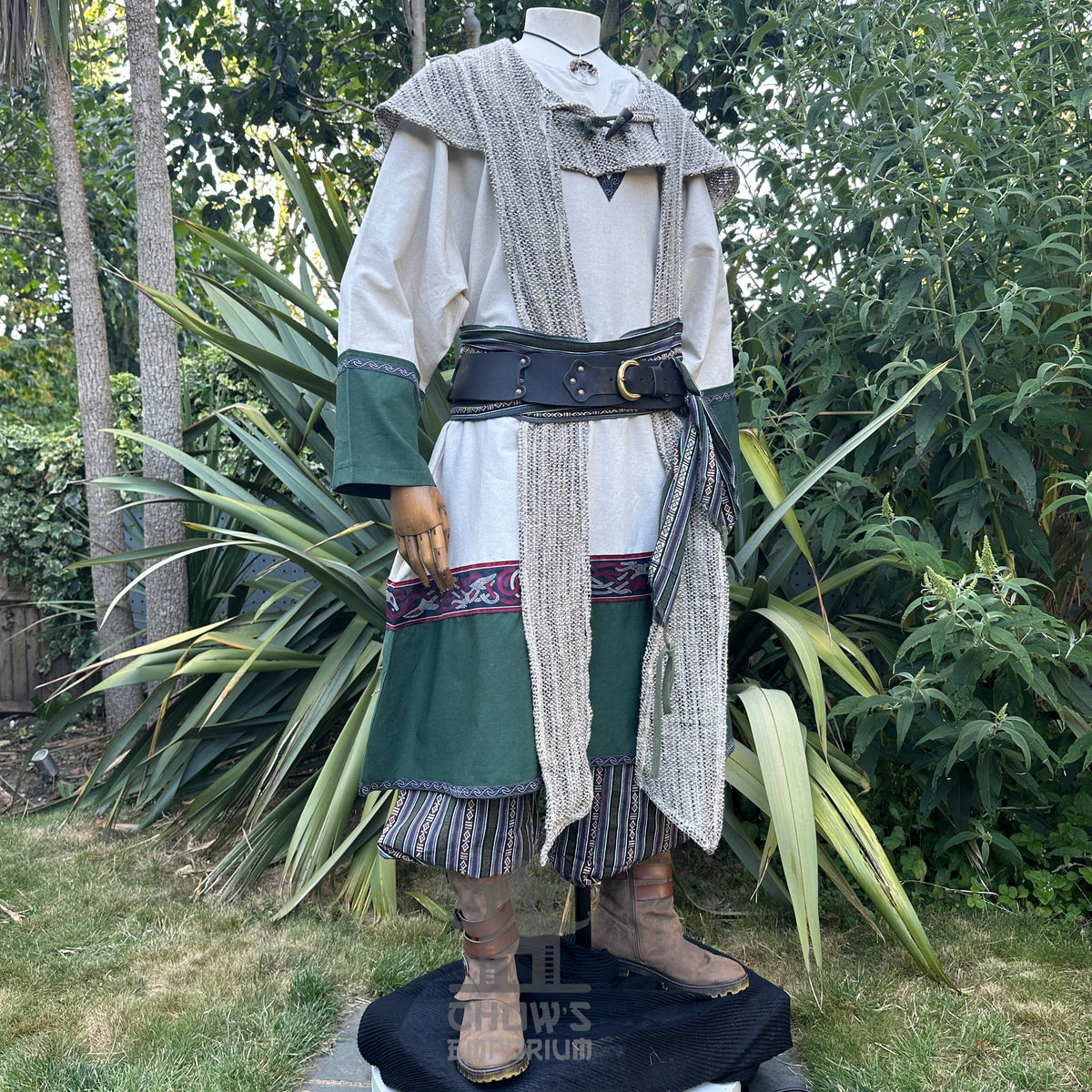 Medieval LARP outfit side view, featuring a two-tone tunic, woollen hood, trousers and matching.