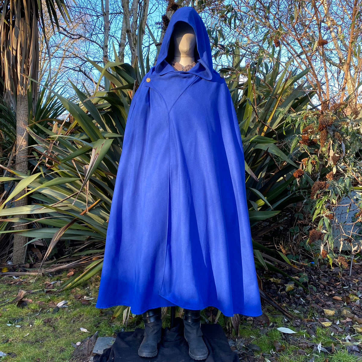 Royal blue Viking LARP cloak with hood, displayed.