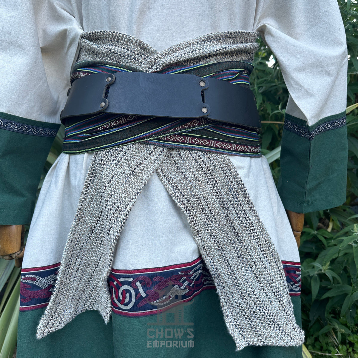 Rear view of LARP medieval outfit with green trim and chainmail sash.
