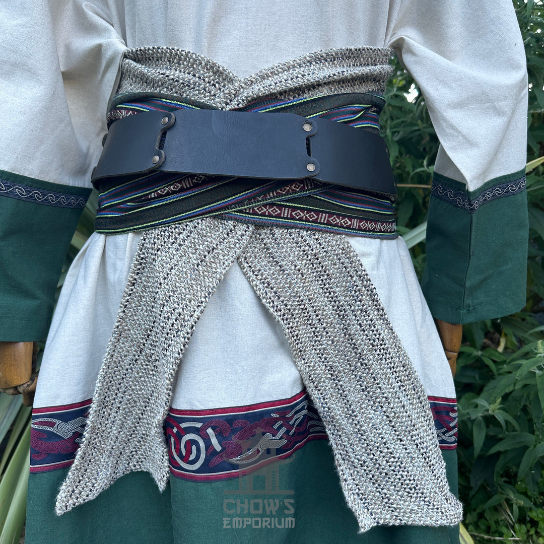Rear view of LARP medieval outfit with green trim and chainmail sash.