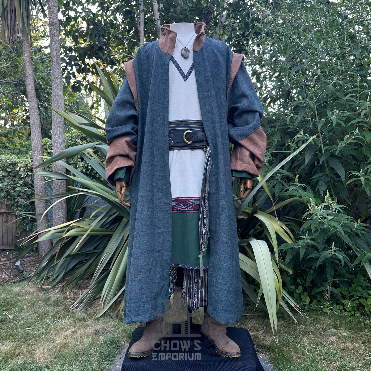 Medieval LARP costume front view featuring teal robe, tunic, pants, belt, sash and necklace.