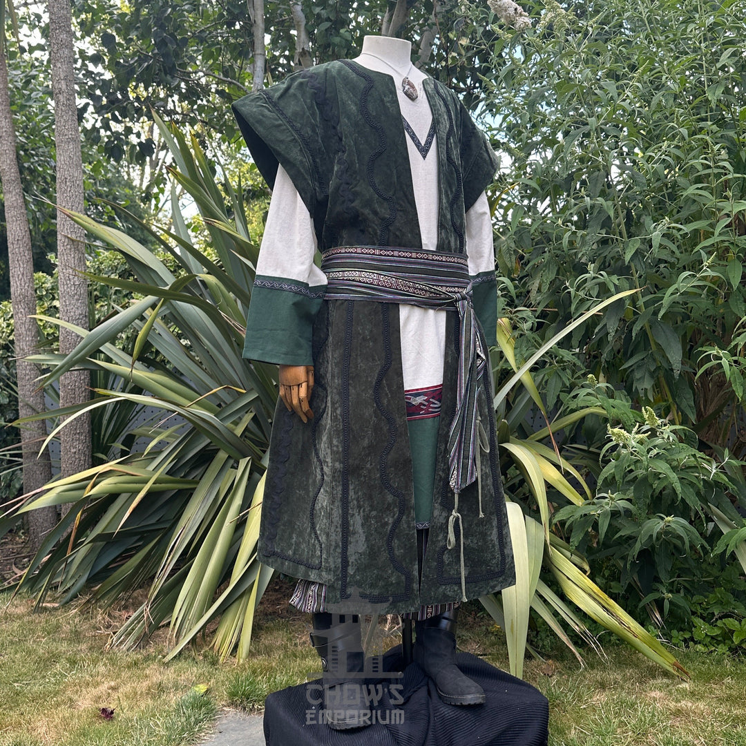 Medieval LARP costume side view featuring waistcoat, tunic, pants, belt and sash.