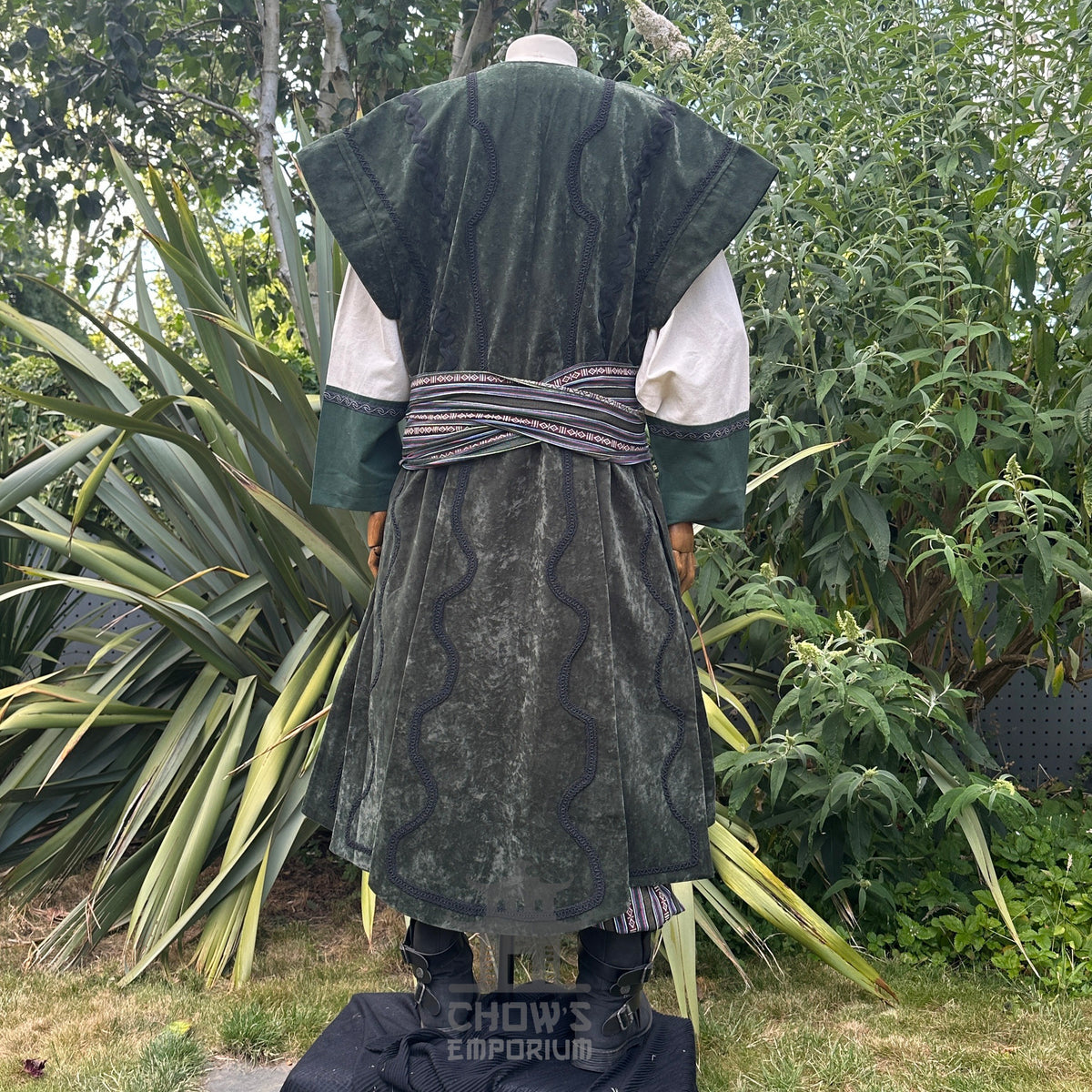 Medieval LARP costume back view featuring waistcoat, tunic, pants, belt and sash.