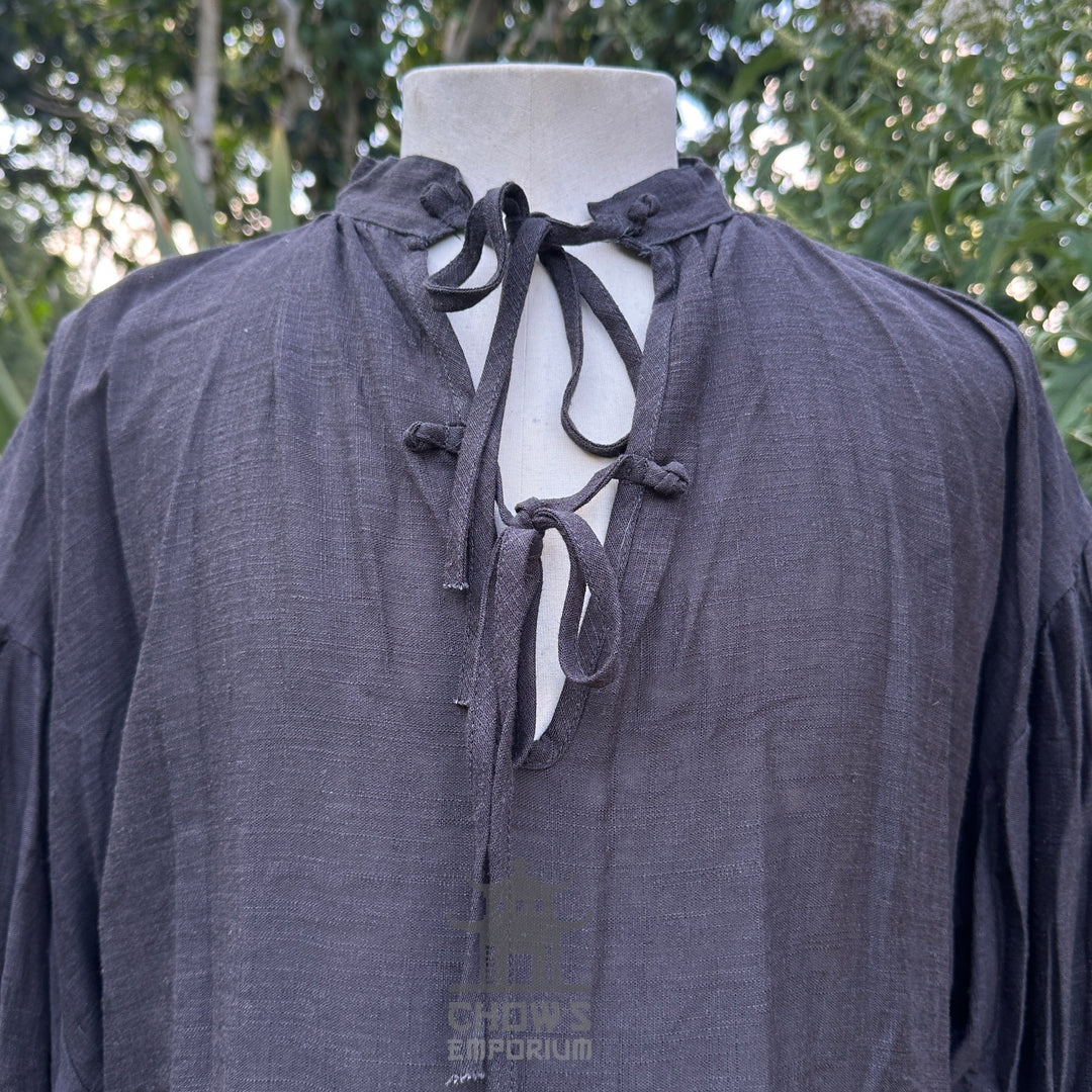 Grey medieval-style shirt with strings, front view.