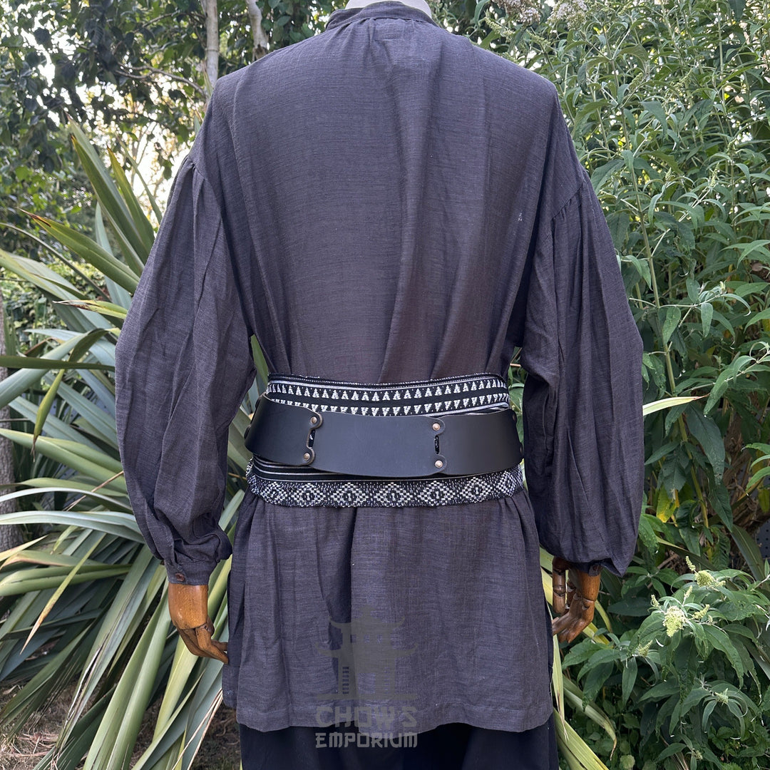 Black medieval LARP shirt with intricate belt and sash, back view.