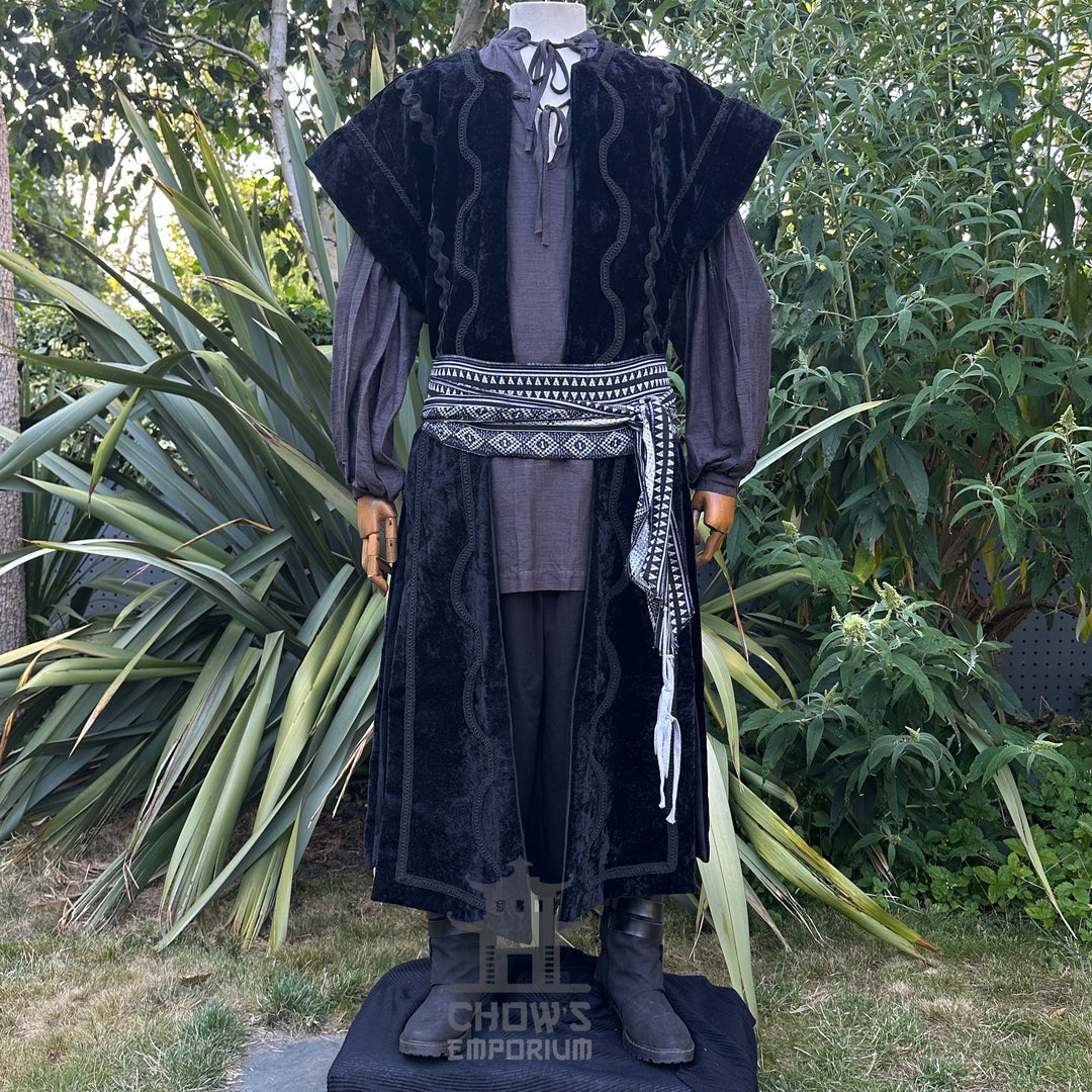 LARP costume with black velvet waistcoat and patterned sash.