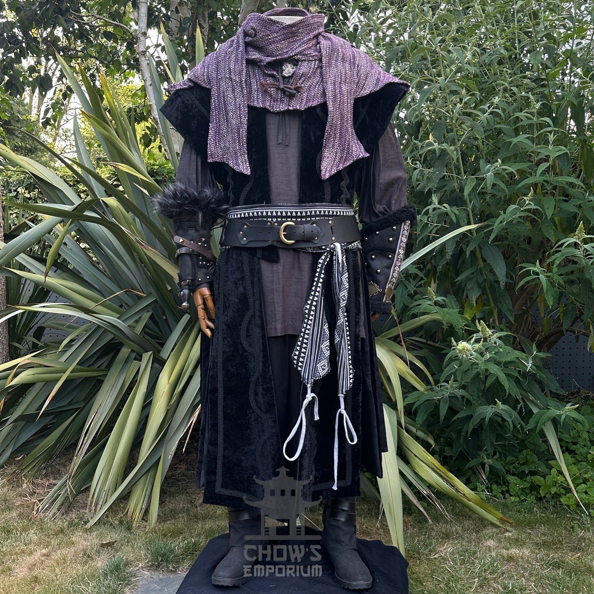 Medieval LARP outfit front view, featuring black suede-effect waistcoat, purple hood and sash.