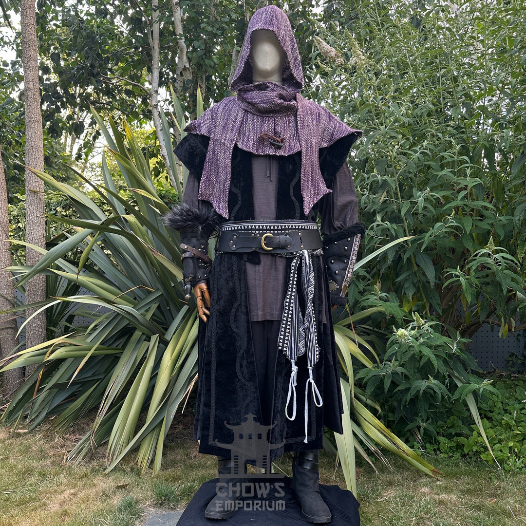 LARP medieval set with purple hood, black waistcoat, vambraces, and detailed belt.