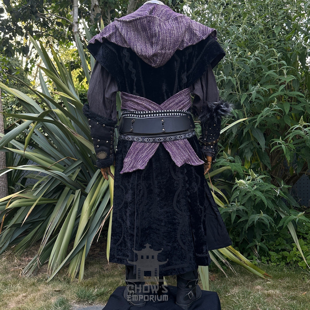 Medieval LARP outfit back view, featuring black suede-effect waistcoat, purple hood and sash.