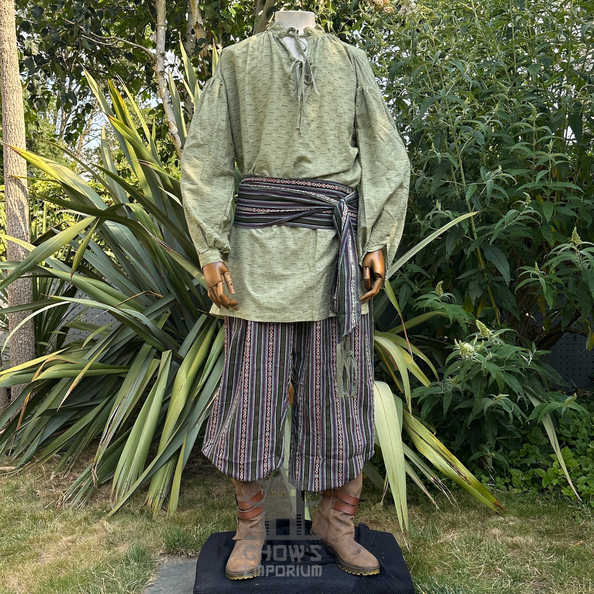 Medieval textured green cotton-linen shirt, front view.