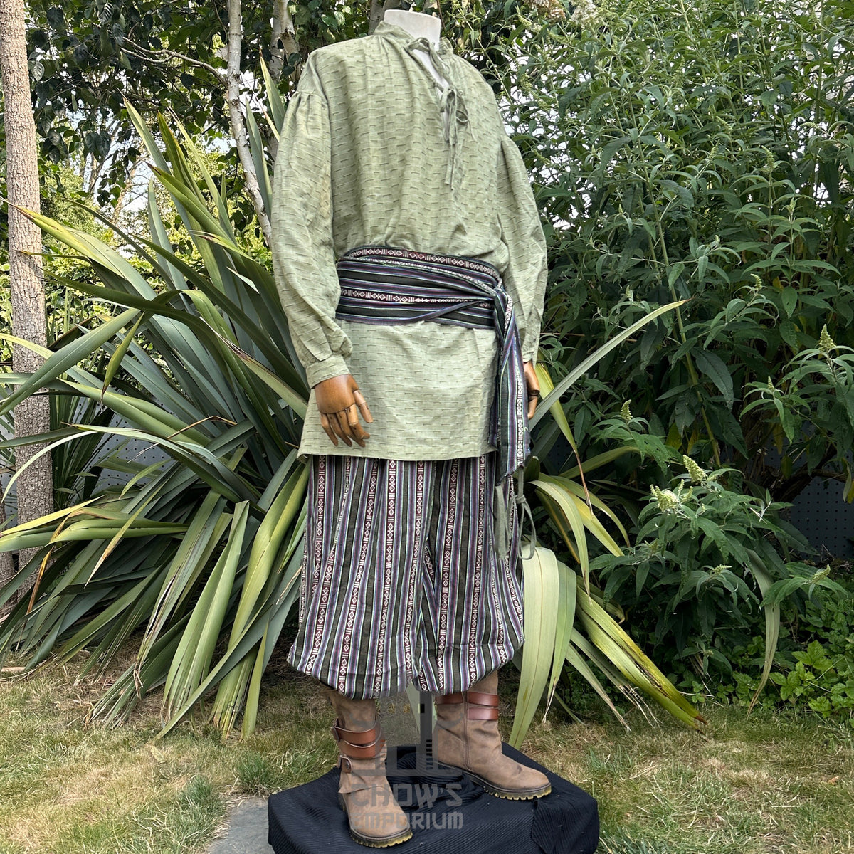 Medieval LARP shirt in textured green cotton-linen, side angle view.