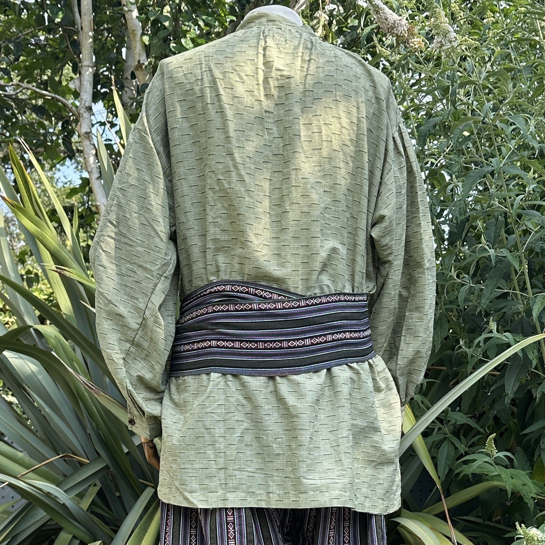 LARP medieval outfit, back view of green shirt, striped pants and sash.
