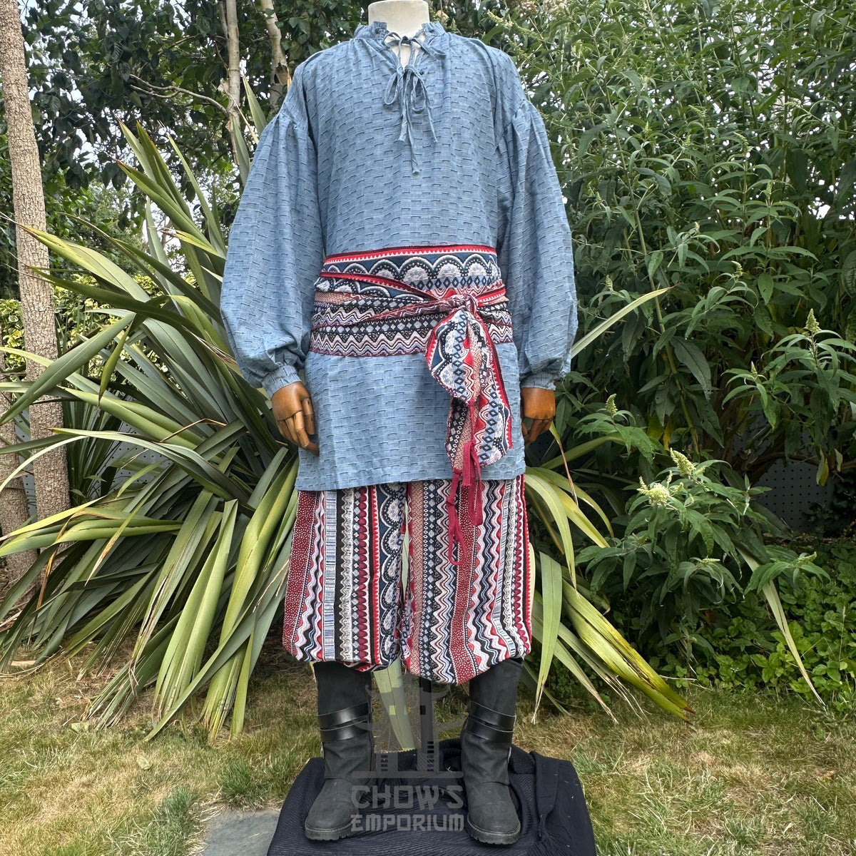 Blue medieval shirt with zigzag red sash and pants, LARP outfit.