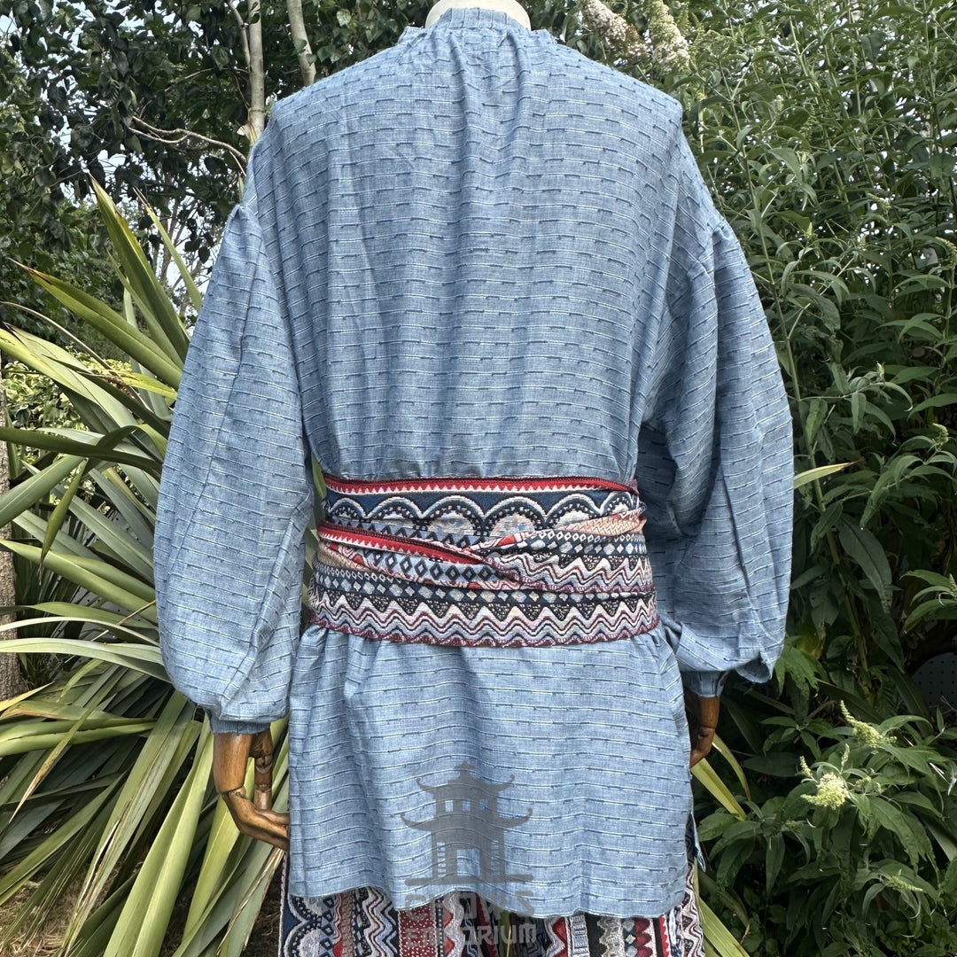 Blue medieval shirt and patterned sash, back view for LARP outfit.