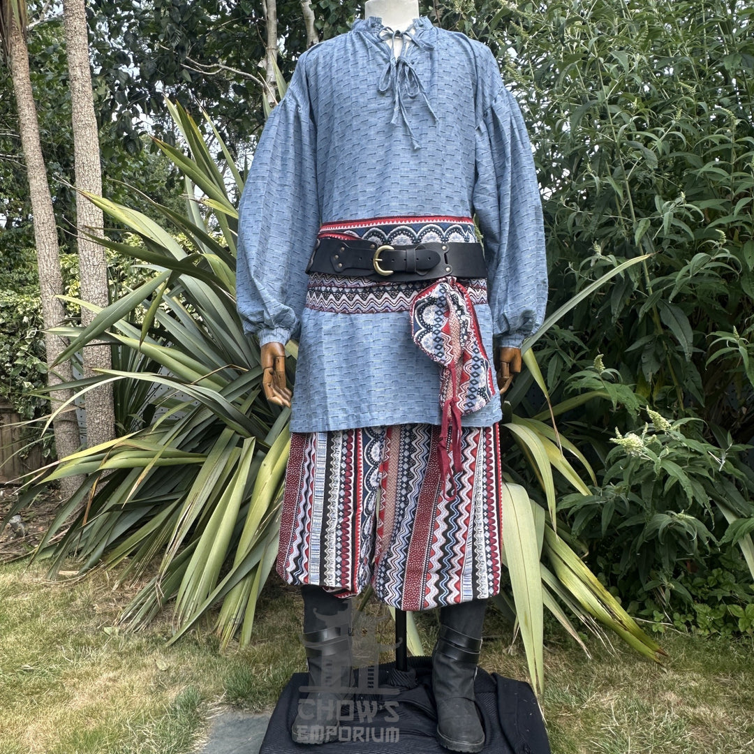 LARP blue medieval shirt, red Nordic zigzag pants, and sash on mannequin.