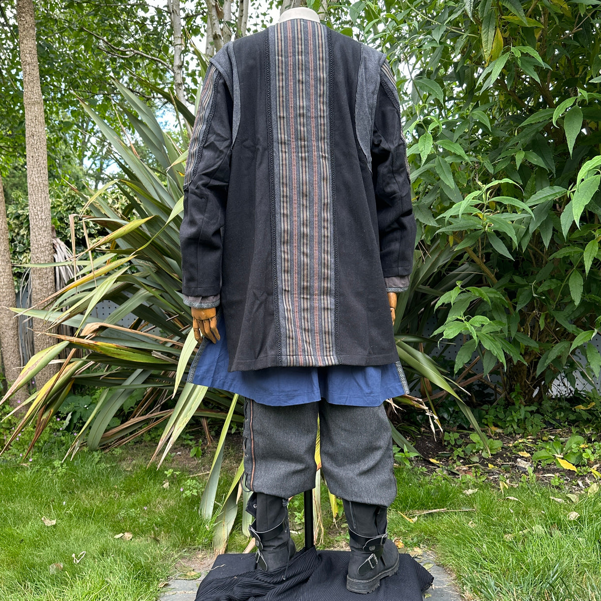 Back view of LARP druid set with black jacket, striped detail, blue underlayer.