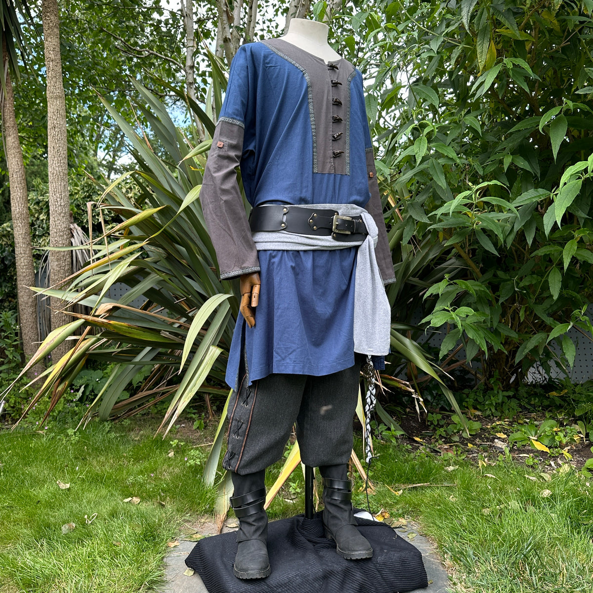 Blue tunic with grey sleeves, sash, and pants on mannequin for LARP.