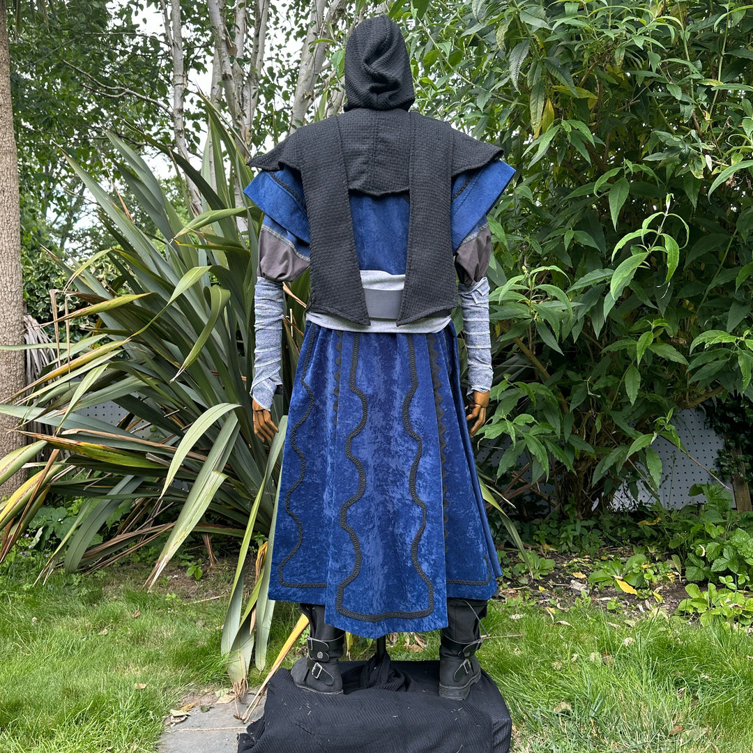 Medieval LARP costume back view, blue velvet tunic with black hood.