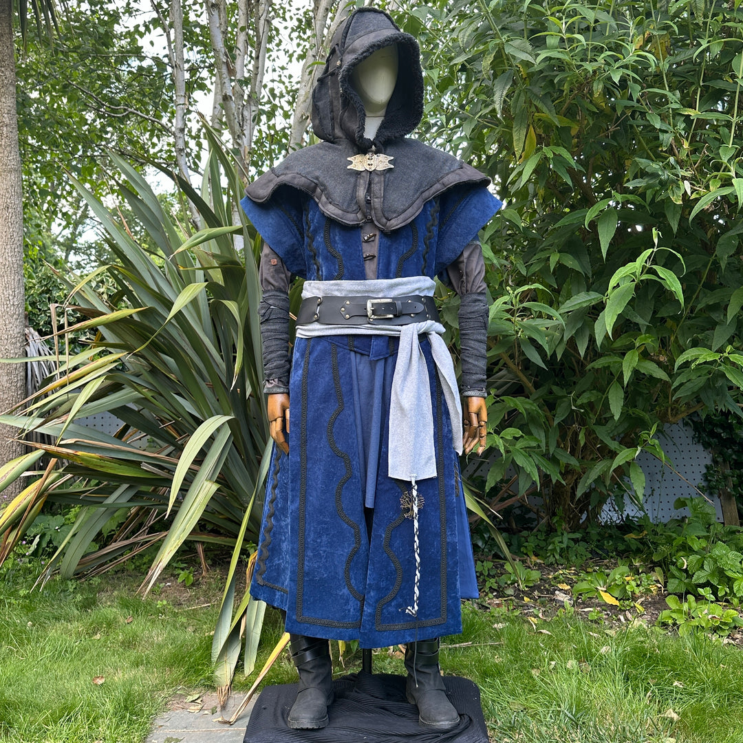 Medieval LARP costume front view, featuring a blue suede-effect panel waistcoat, black layered.