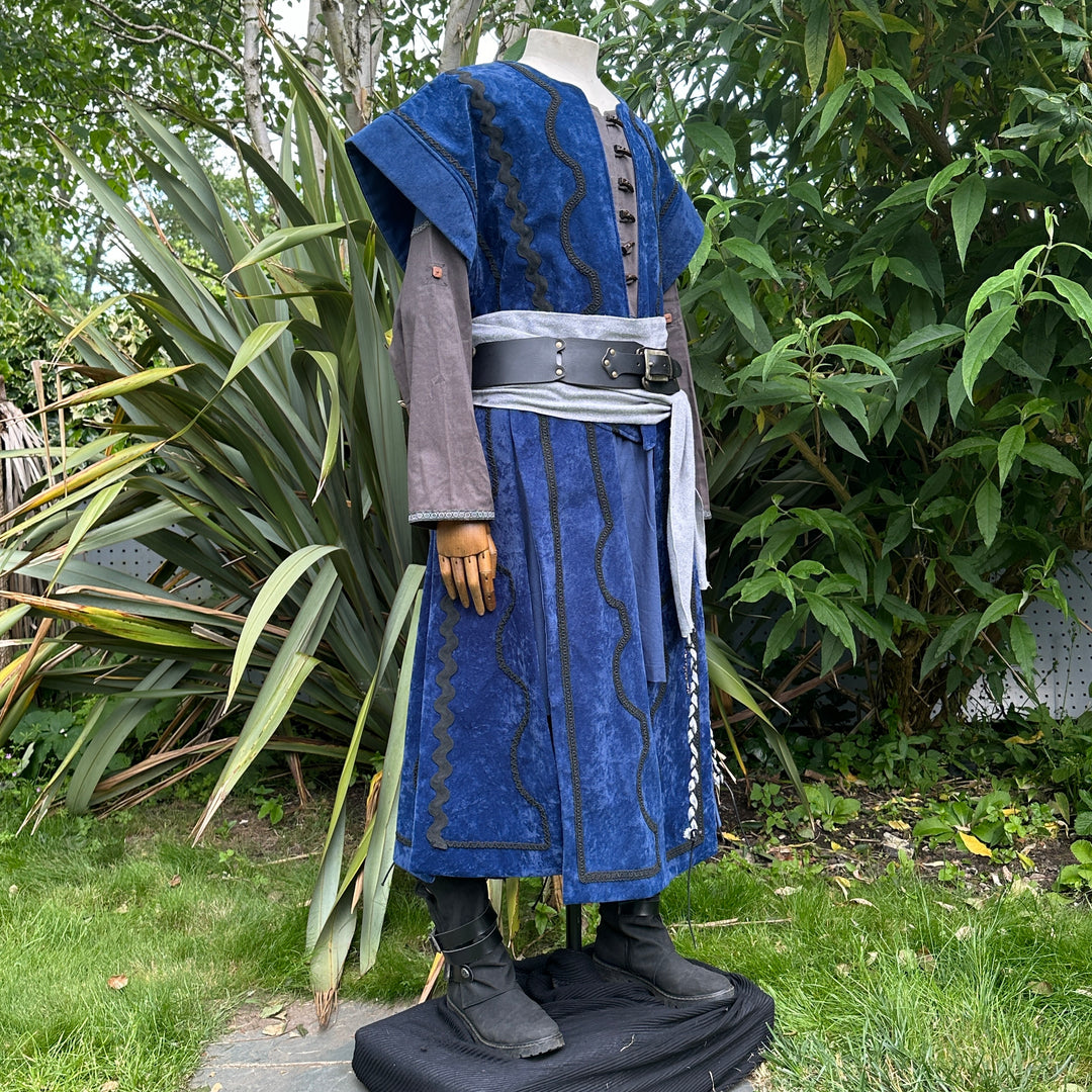Medieval LARP costume side view, featuring a blue suede-effect panel waistcoat, two-tone cotton.