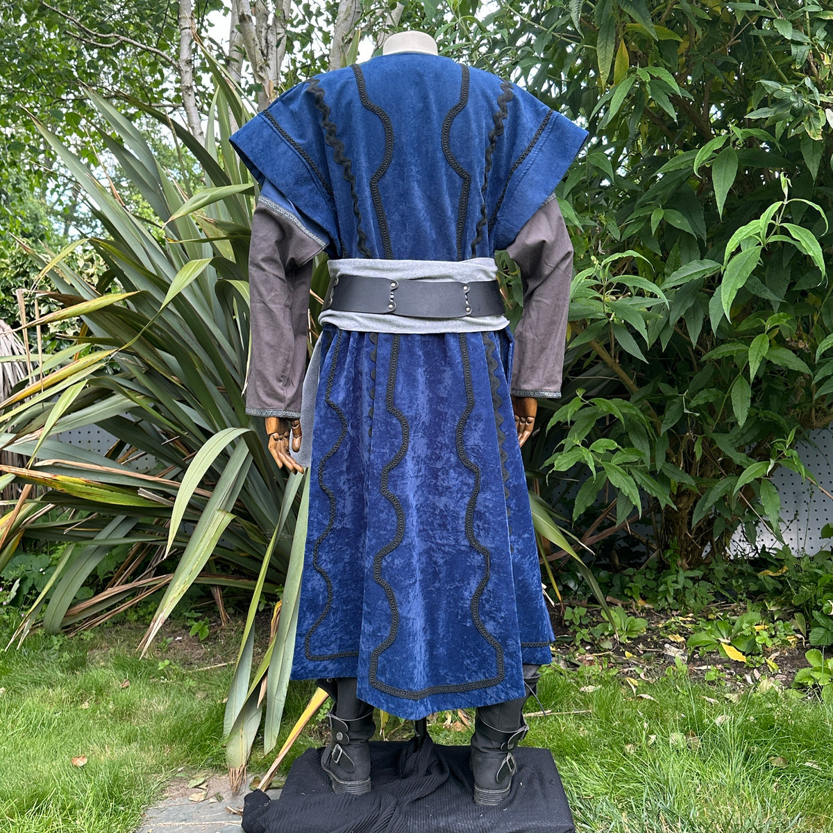 Medieval LARP costume back view, featuring a blue suede-effect panel waistcoat, two-tone cotton.