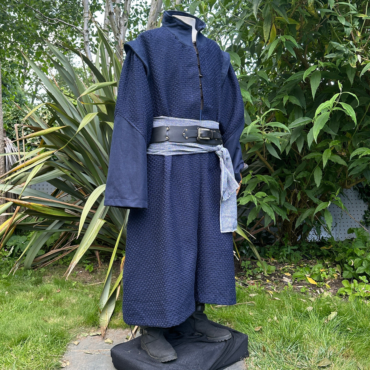 Blue LARP robe with high collar, textured fabric, front view.