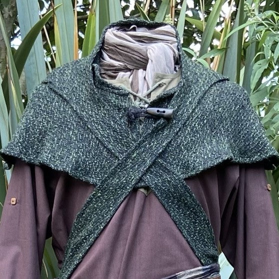 Medieval LARP outfit with green hooded shawl layered over brown tunic.