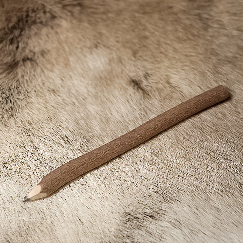 Rough twig pencil on fur for medieval LARP, angled side view.