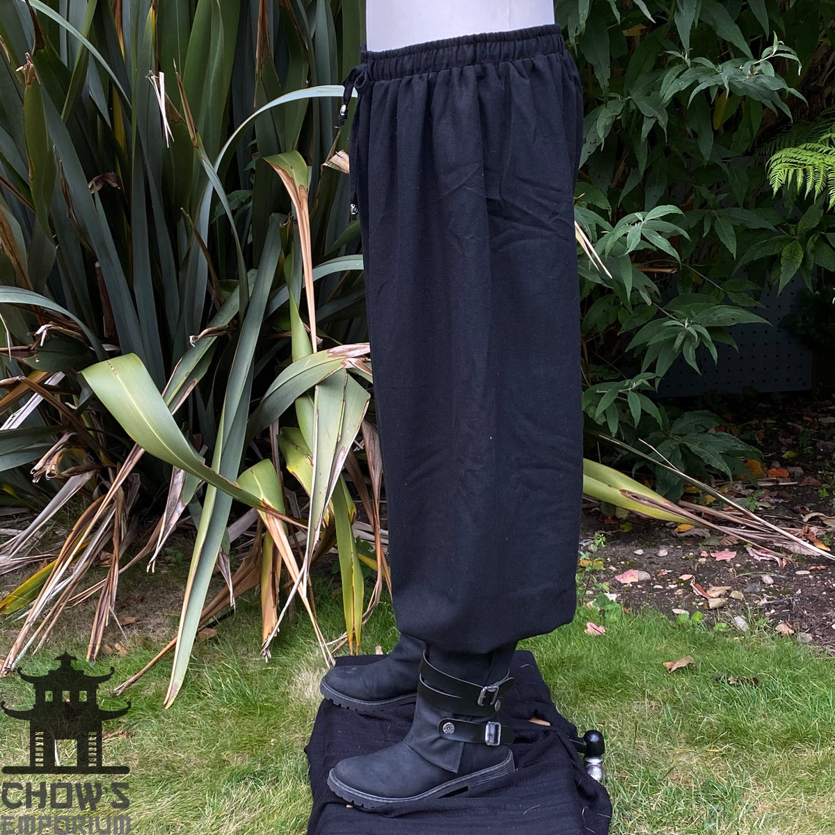 handmade black cotton hero pants with drawstring waist.