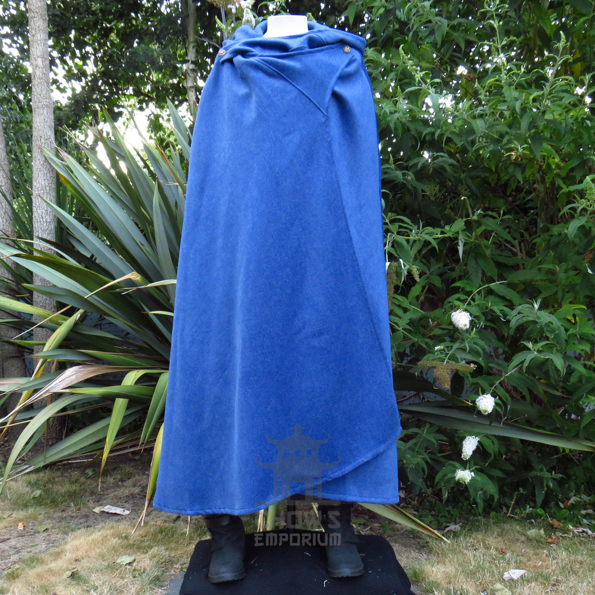 Blue medieval cloak fastened closed with the hood folded down at the back