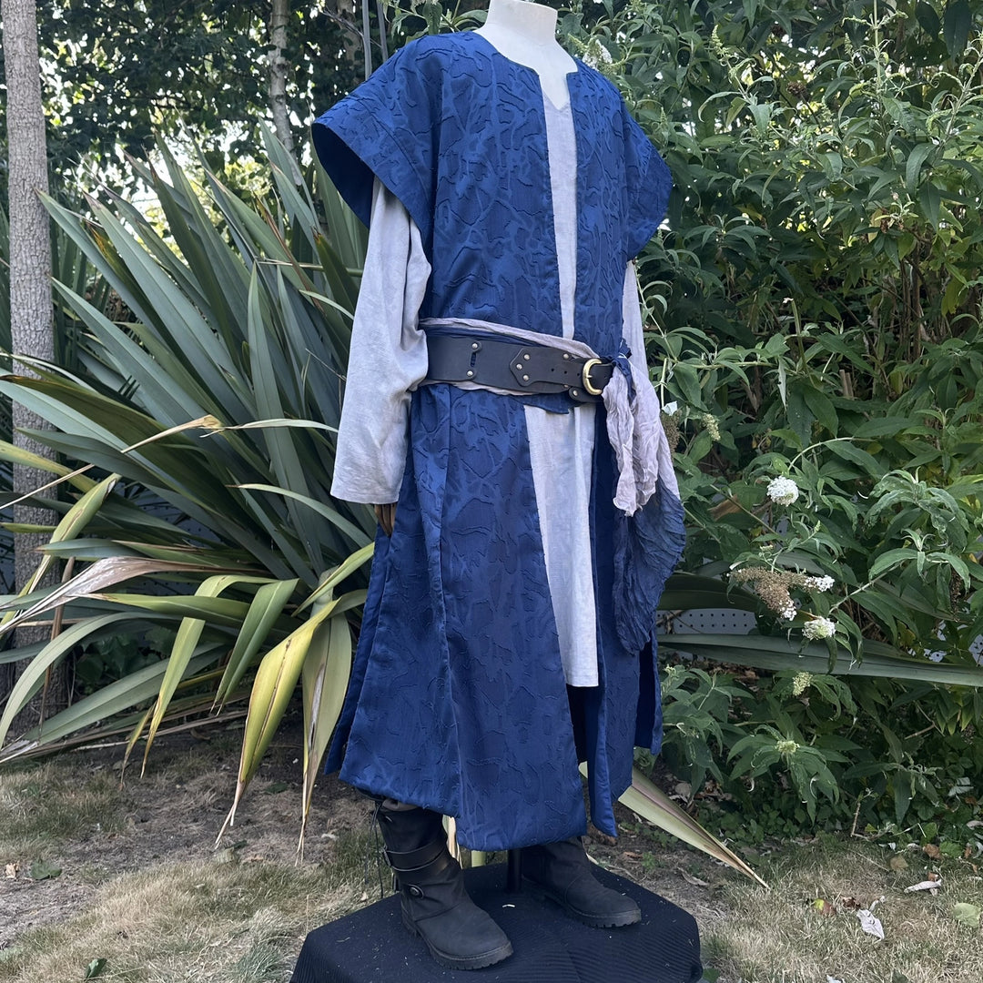 Blue panelled waistcoat and hood set, hood down, three-quarter view. Belt sold separately.