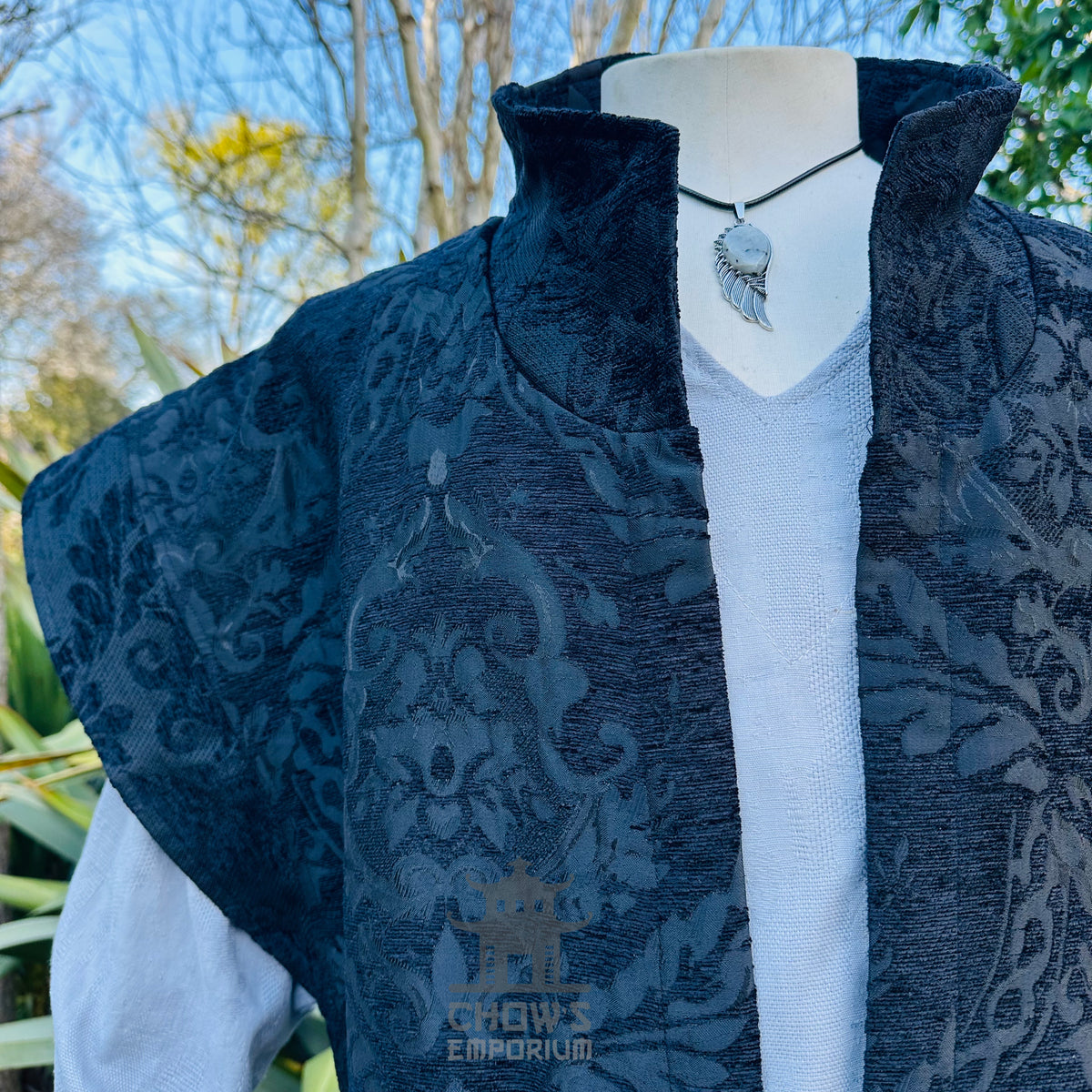 High collar detail on the black brocade waistcoat