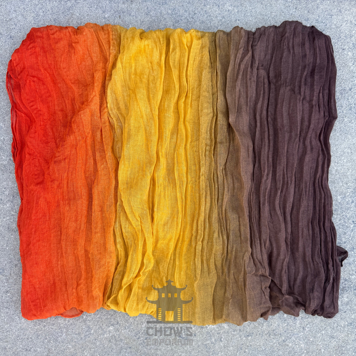 Folded Ember pirate sash showing brown, gold and orange gradient