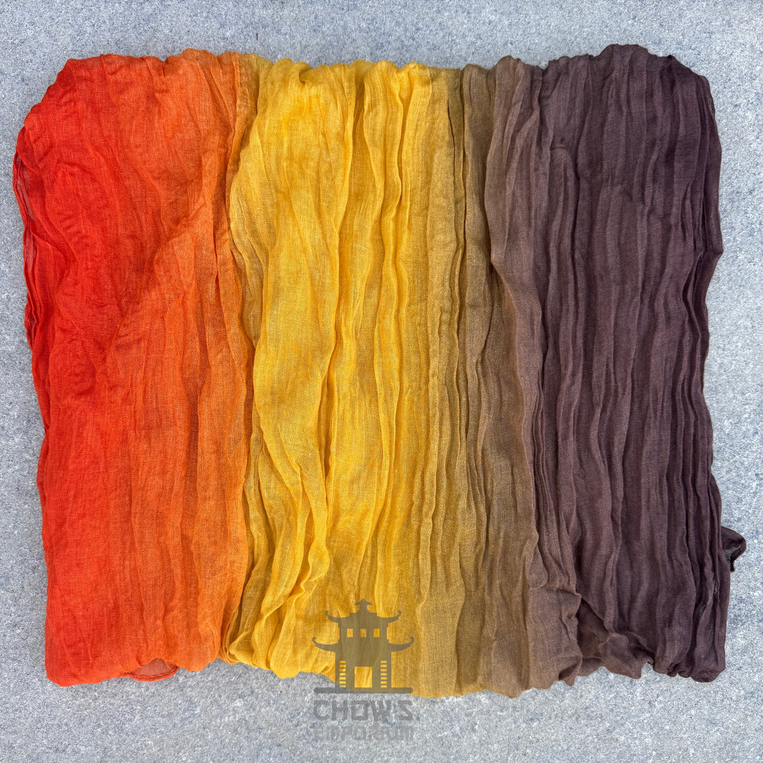 Folded Ember pirate sash showing brown, gold and orange gradient