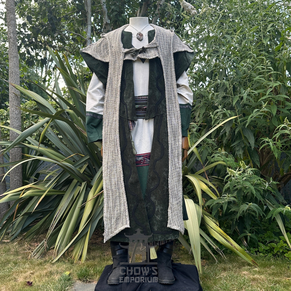 Medieval LARP costume with layered tunic and textured cloak.