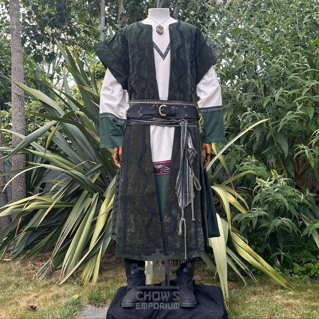 Medieval LARP outfit outdoors, green accents, tunic with decorative belt.
