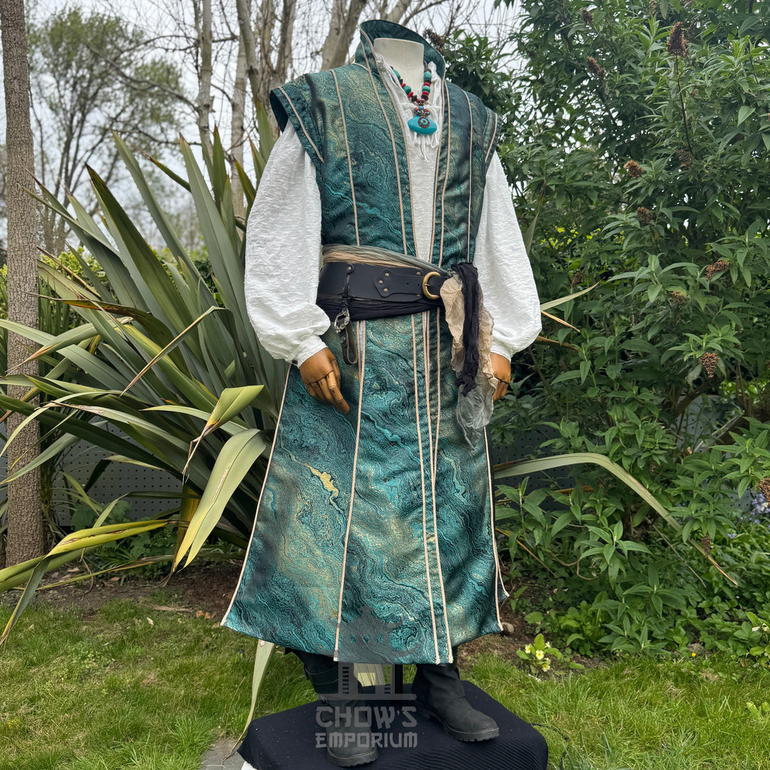 Angled view of the green and gold marble waistcoat worn over the white shirt, pirate lord LARP and cosplay costume
