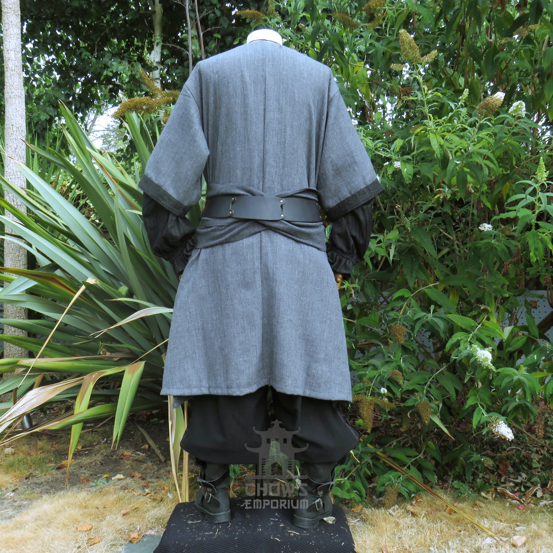 Grey woven medieval tunic from the back, black panel down the centre and a tied sash at the waist. Sash sold separately.