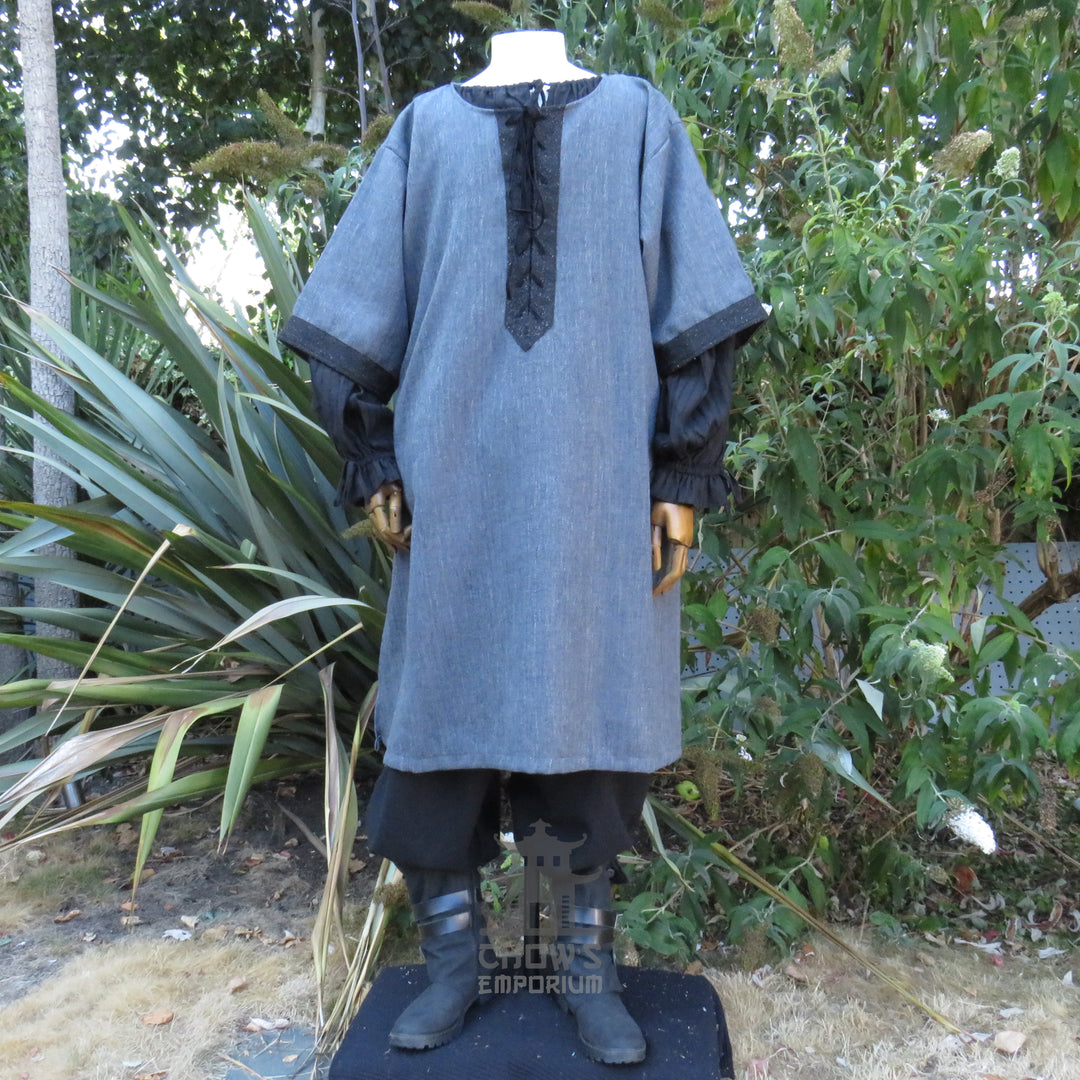 Front of the grey woven medieval tunic showing the black faux-suede lace-up panel down the chest.