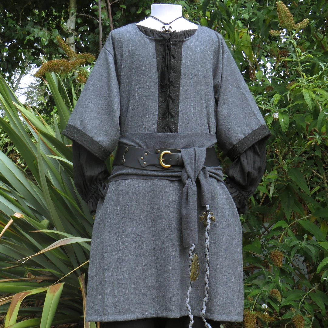 Grey and black woven medieval tunic with a black faux-suede lace-up chest panel, worn belted, front view. Belt sold separately.