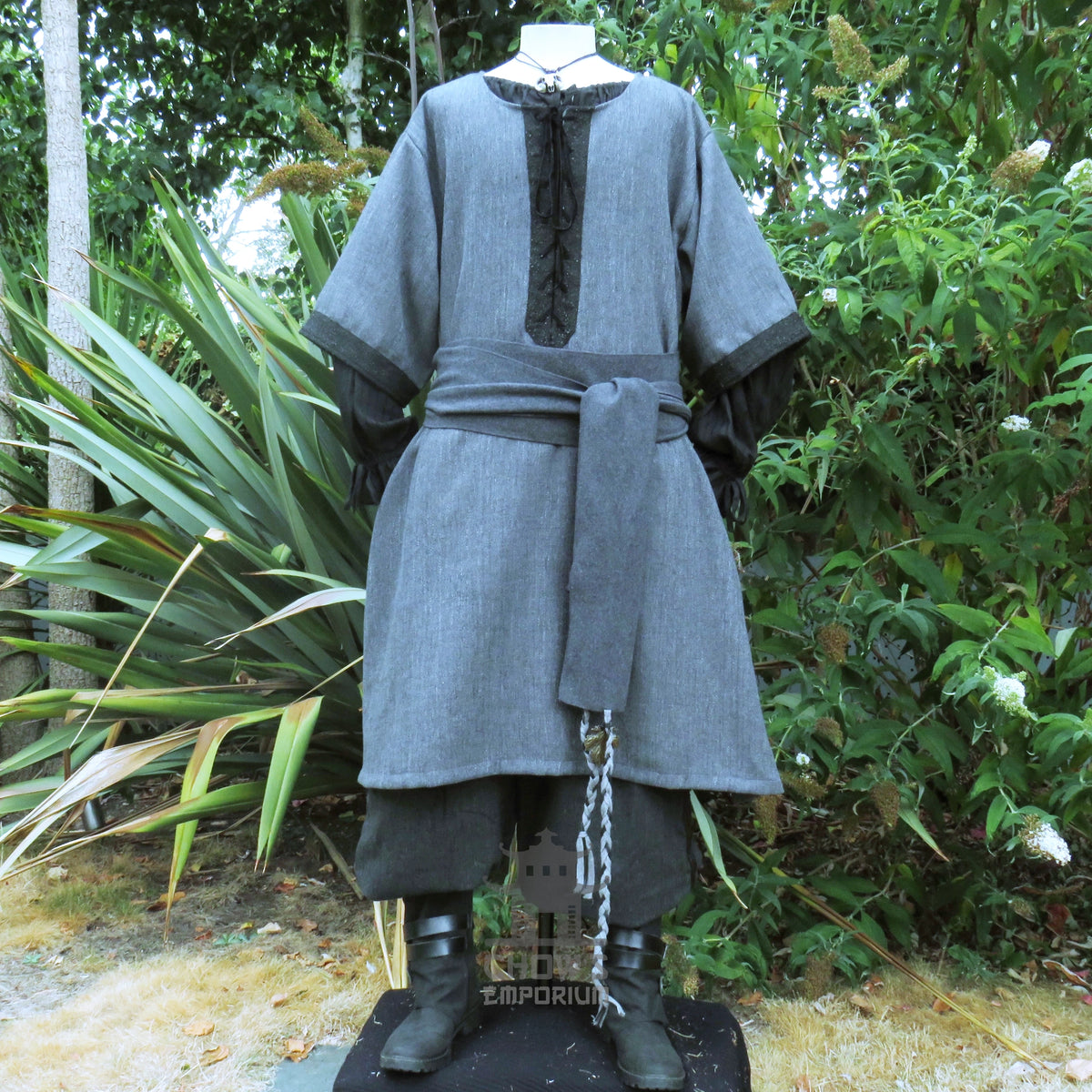 Grey woven medieval tunic, full-length front view unbelted, with black cuffs and centre panel.