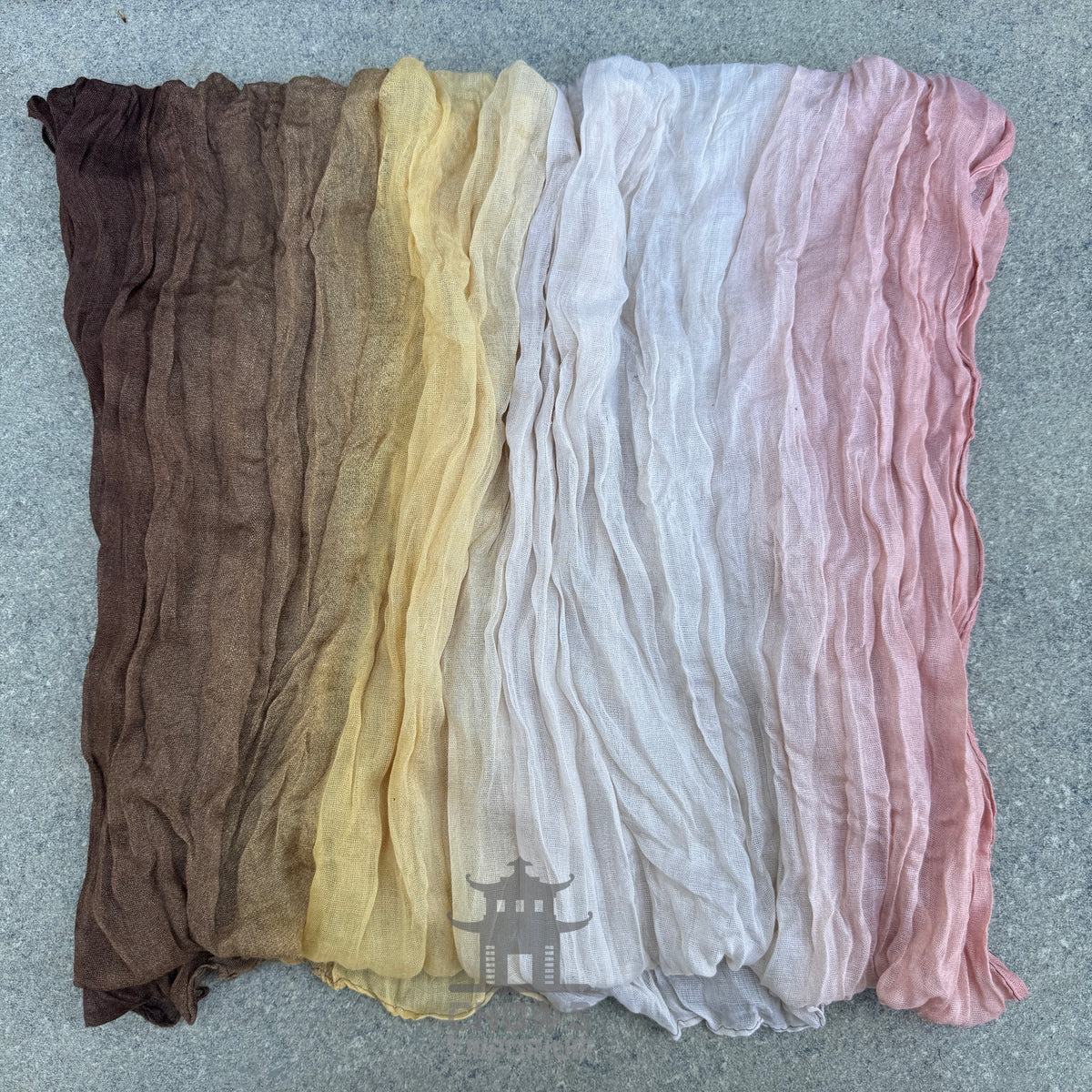 Folded Harvest pirate sash showing brown, gold, cream and pink mix