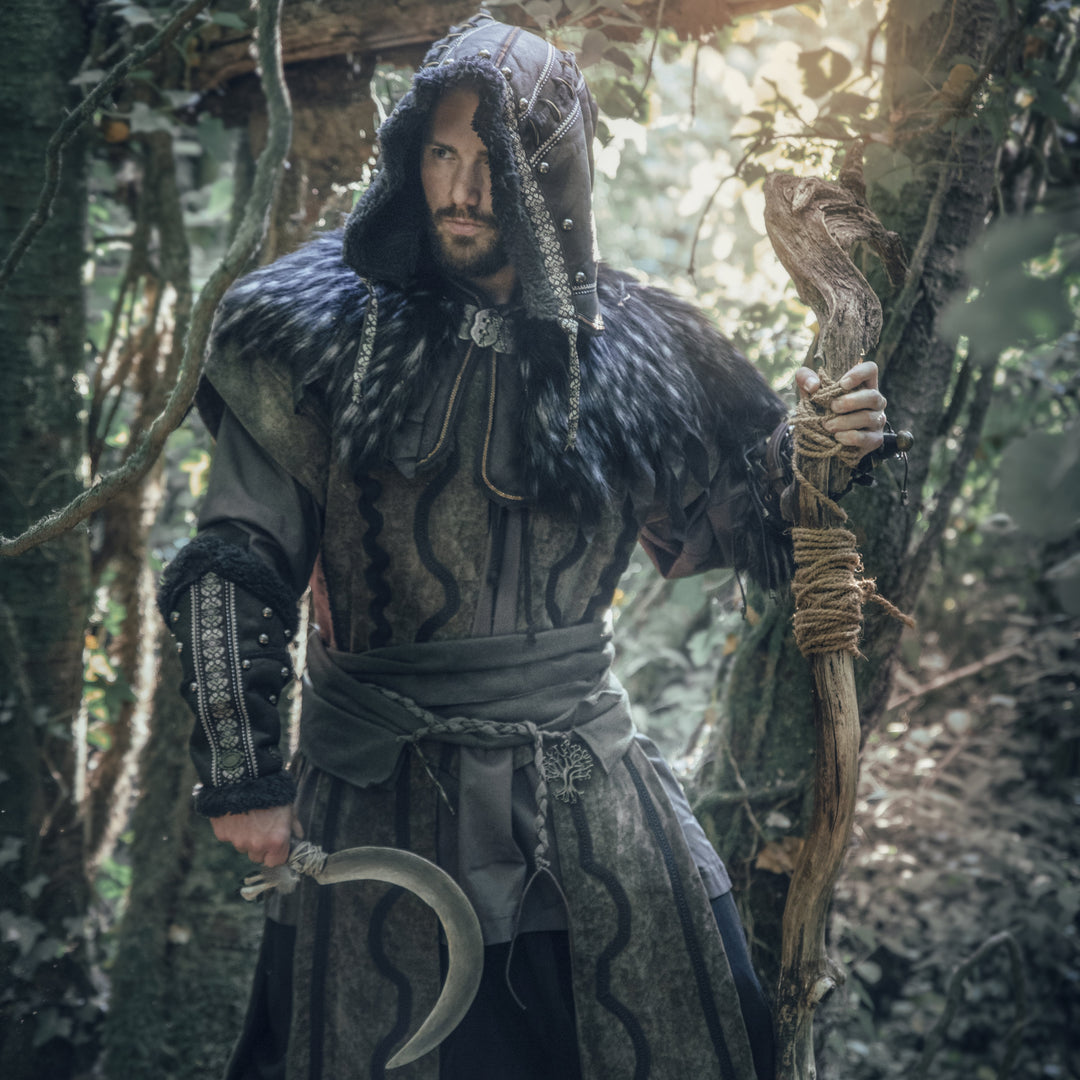 Medieval LARP costume side view with hood and fur details.