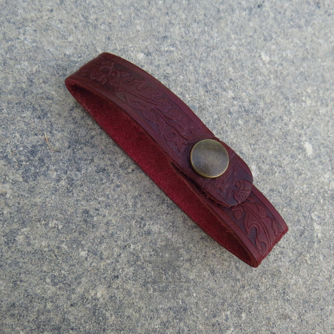 Dark red leather tankard loop on a belt with a tankard attached
