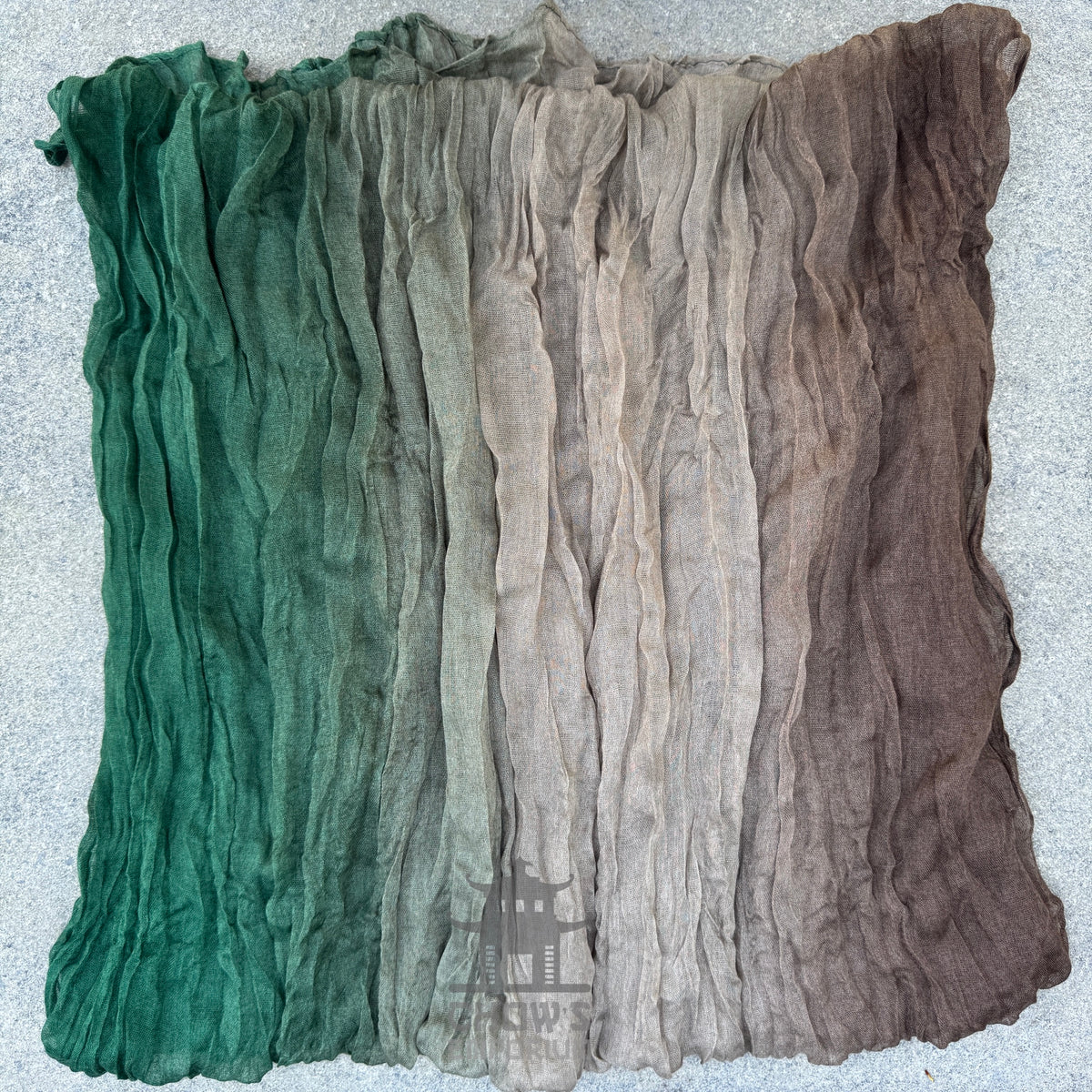 Folded Moss pirate sash showing muted brown, beige and green mix