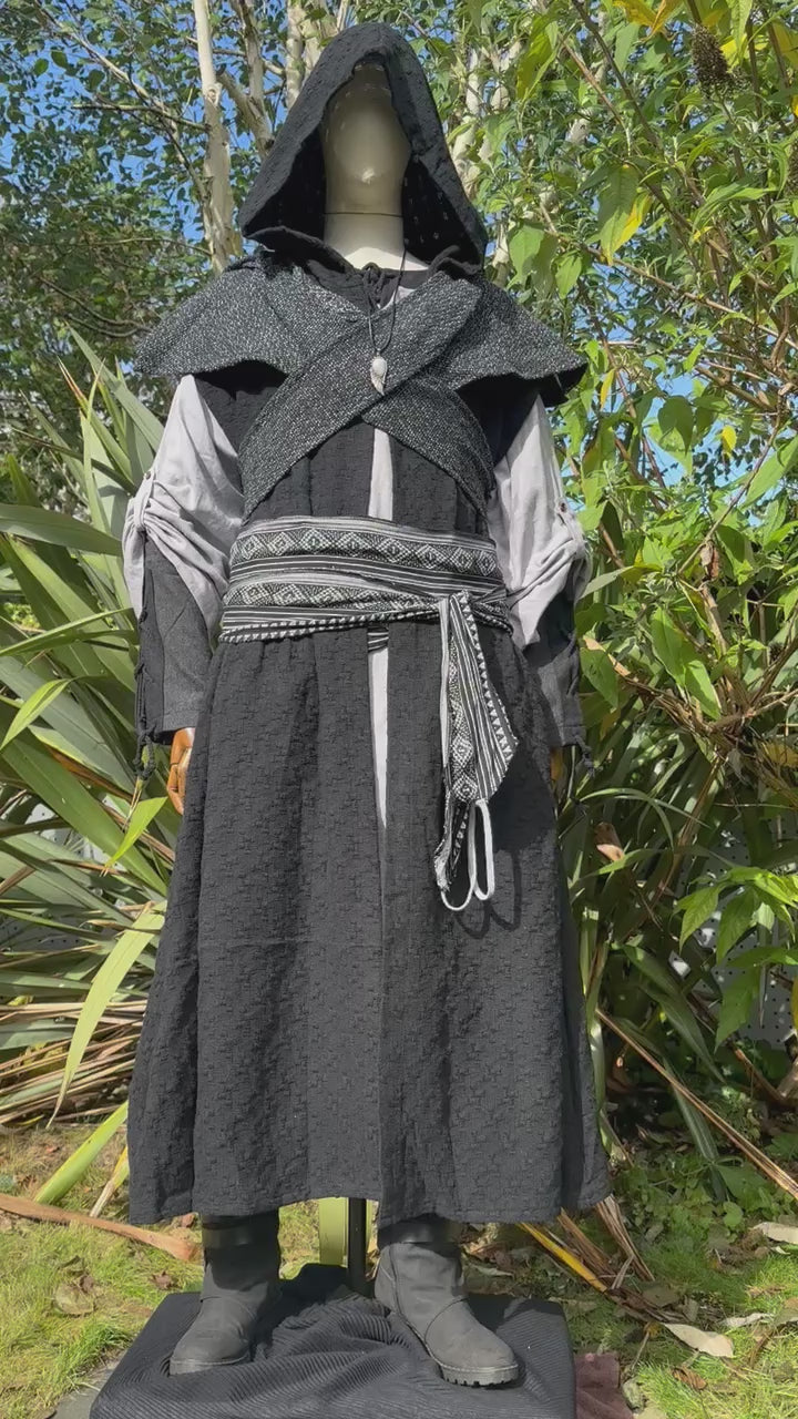 Full view of black hooded sleeveless LARP robe, medieval fantasy cosplay costume for wizards, monks, or assassins at Renaissance Faires.