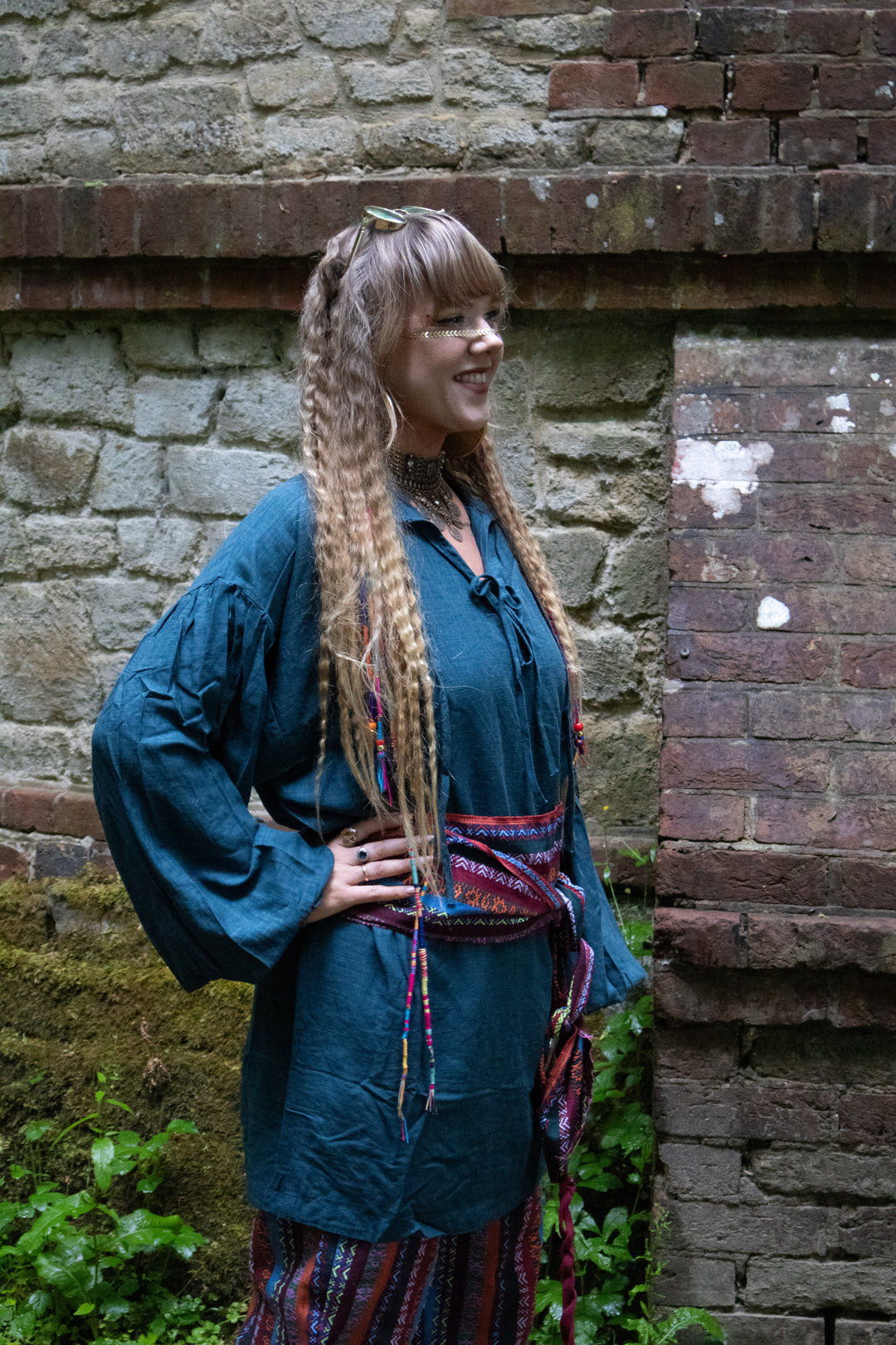 Medieval teal shirt with belted waist, outdoor setting, LARP cosplay.