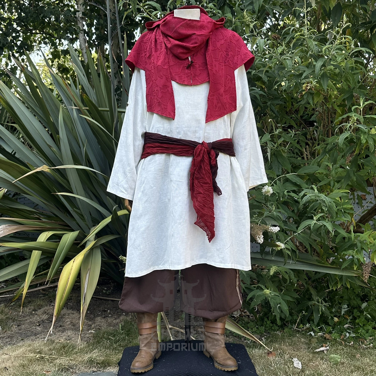 Red cotton scarf hood with the ends hanging loose at the front